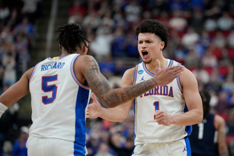 Florida Gators guard Walter Clayton Jr. (1) reacts with guard Will Richard (5) in the second half at Lenovo Center.