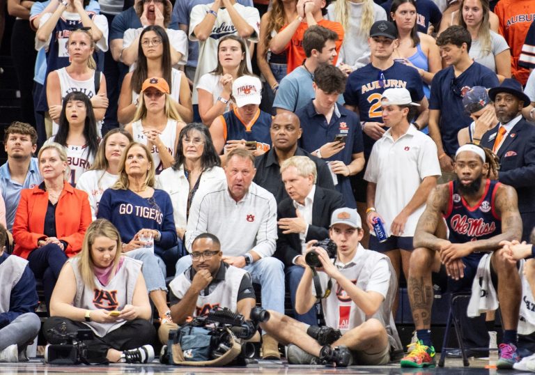 Former Auburn and NBA player Charles Barkley, Auburn football coach Hugh Freeze and Bill Neville take in the game as Auburn Tigers take on Ole Miss Rebels at Neville Arena in Auburn, Ala., on Wednesday, Feb. 26, 2025.