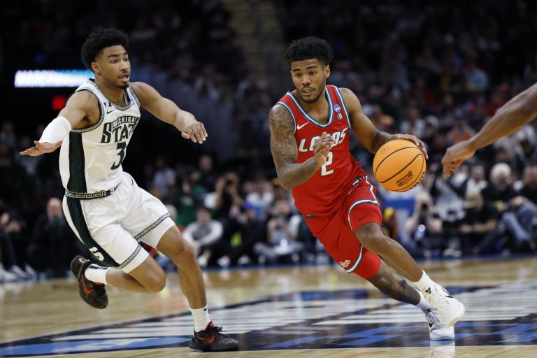 New Mexico Lobos guard Donovan Dent (2) dribbles in the second half against the Michigan State Spartans during the NCAA Tournament Second Round at Rocket Arena.