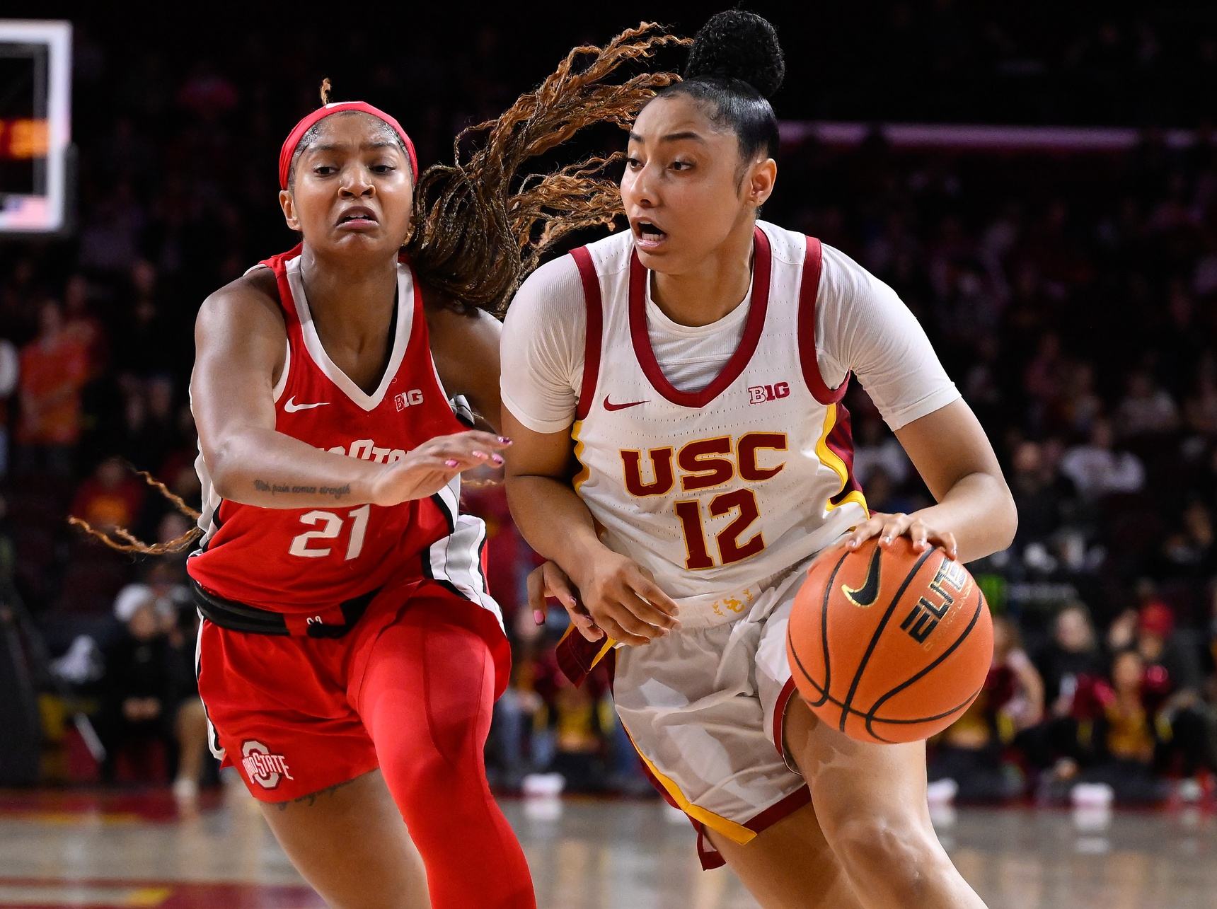 USC Trojans guard JuJu Watkins (12) drives to the basket as Ohio State Buckeyes guard Chance Gray (21) tries to defend during the fourth quarter at Galen Center.