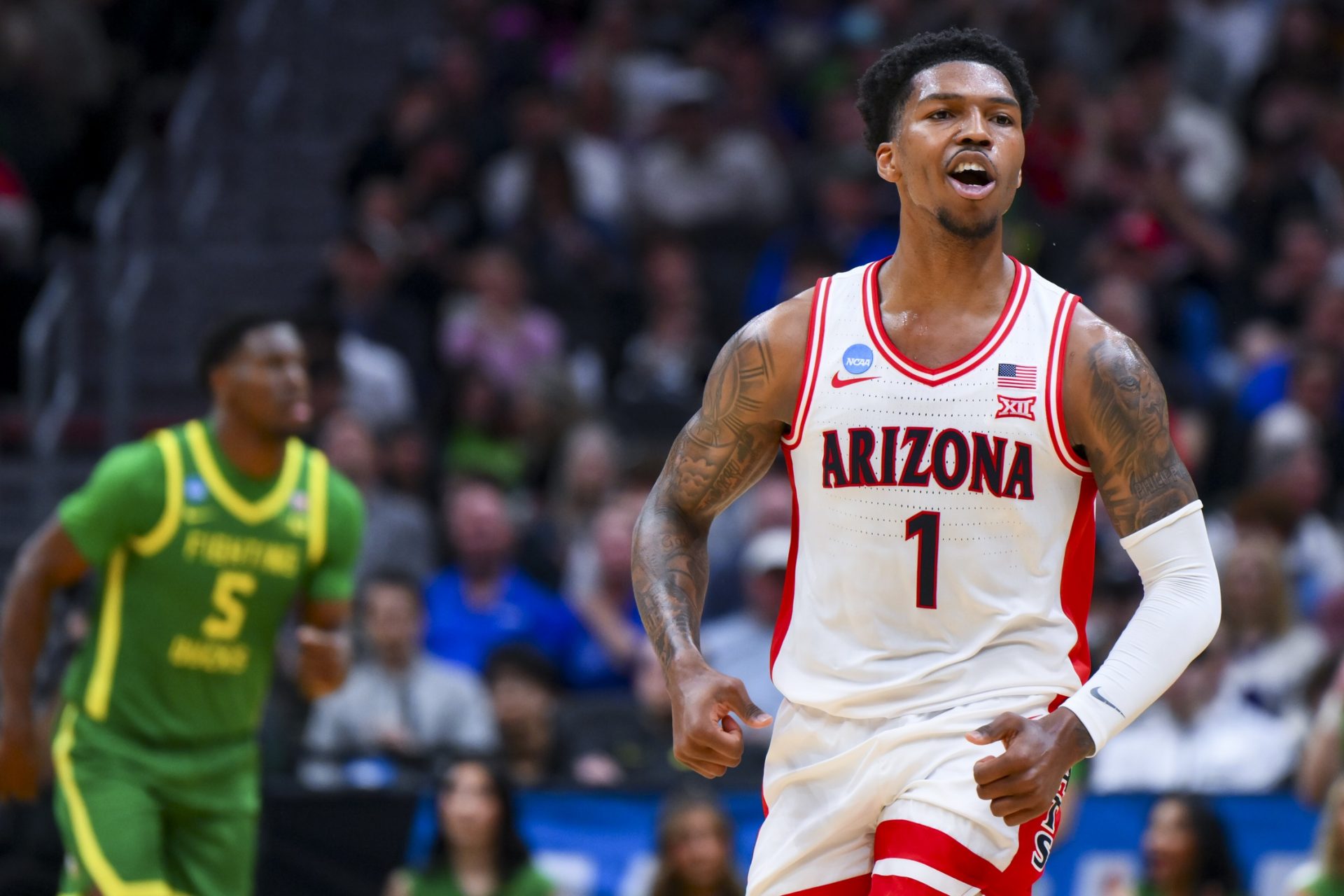 Arizona Wildcats guard Caleb Love (1) reacts against the Oregon Ducks in the first half at Climate Pledge Arena.