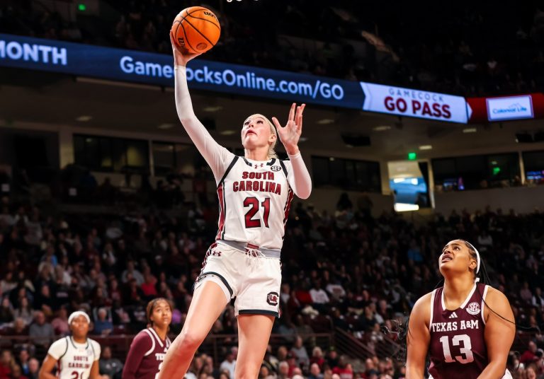 South Carolina Gamecocks forward Chloe Kitts (21) drives past Texas A&M Aggies forward Jada Malone (13) in the first half at Colonial Life Arena.