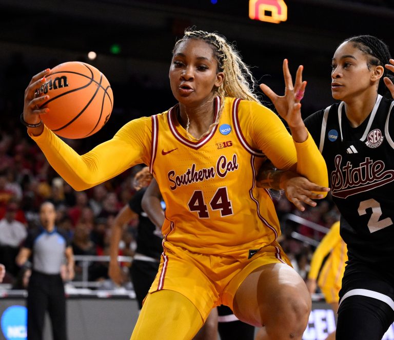USC Trojans forward Kiki Iriafen (44) grabs a rebound in front of Mississippi State Bulldogs guard Jerkaila Jordan (2) during the second quarter of an NCAA Tournament second round game at Galen Center.