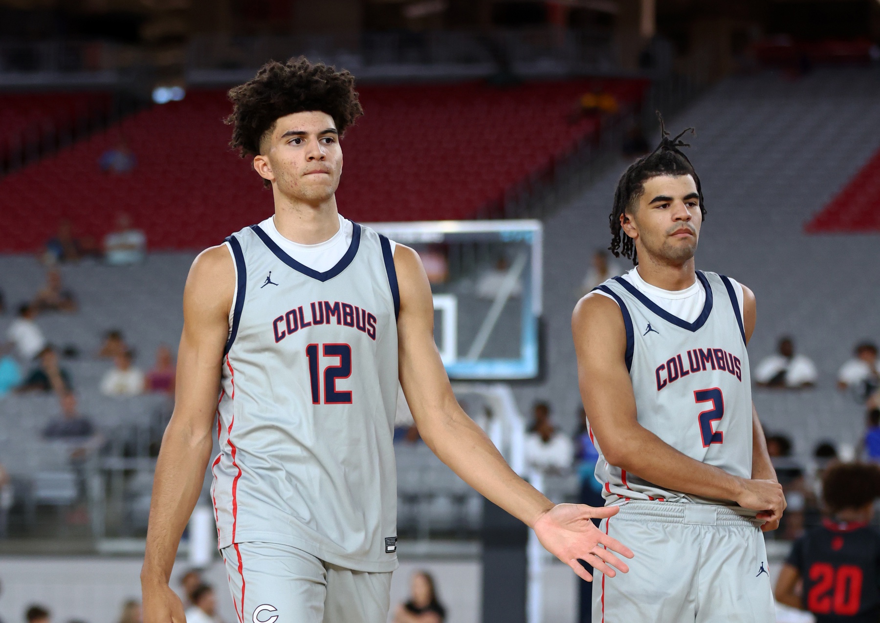 Columbus player Cameron Boozer (12) and brother Cayden Boozer (2) during the Section 7 high school boys tournament at State Farm Stadium.