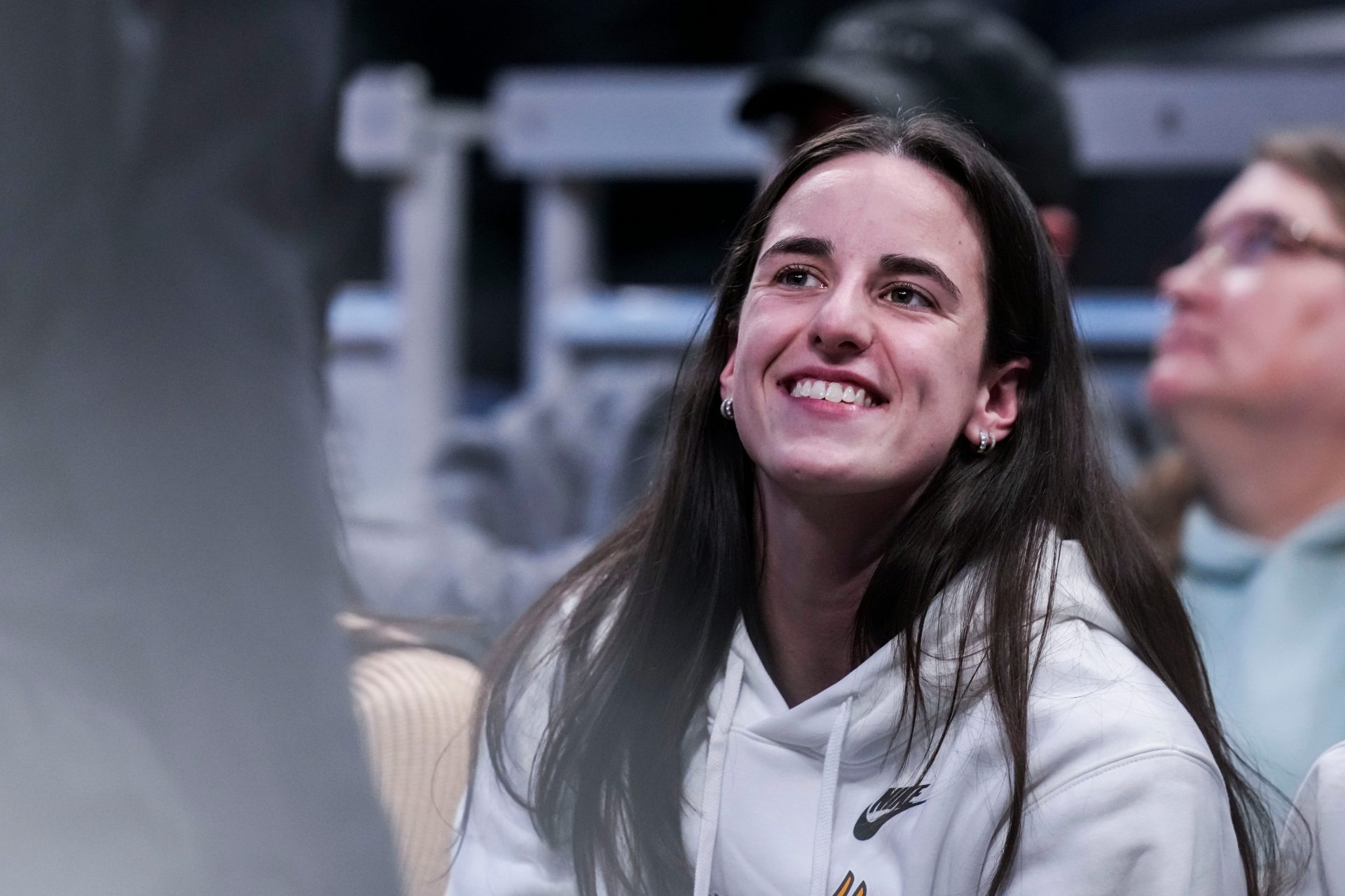 Indiana Fever guard Caitlin Clark (22) smiles Thursday, March 6, 2025, in a round two game at the 2025 TIAA Big Ten Women's Basketball Tournament between the Iowa Hawkeyes and the Michigan State Spartans at Gainbridge Fieldhouse in Indianapolis.