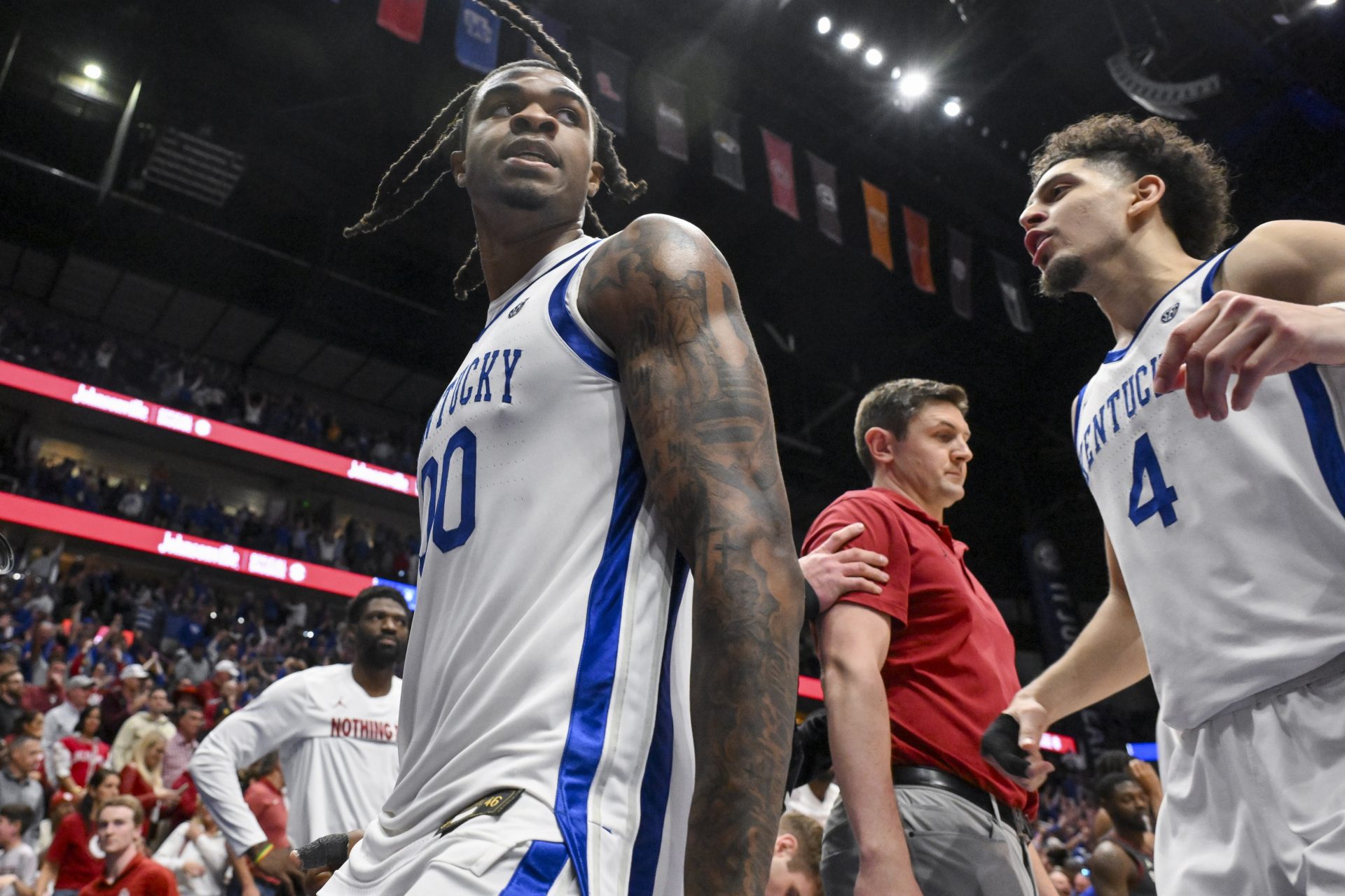 Kentucky Wildcats guard Otega Oweh (00) celebrates the win with guard Koby Brea (4) against the Oklahoma Sooners during the second half at Bridgestone Arena.