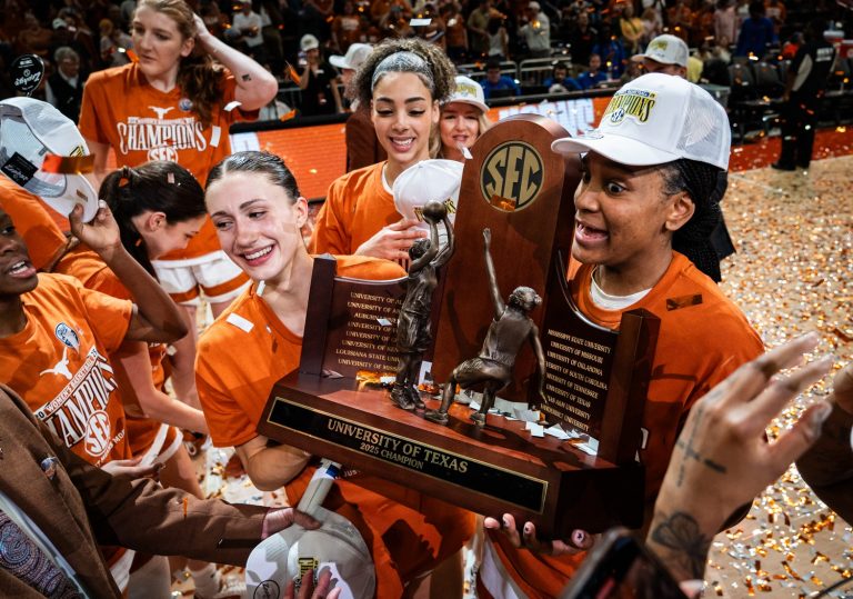 The Texas Longhorns, including Texas Longhorns guard Shay Holle (10) and forward Madison Booker (35) celebrate their regular season SEC Championship after beating Florida at home in the Moody Center, March 2, 2025.