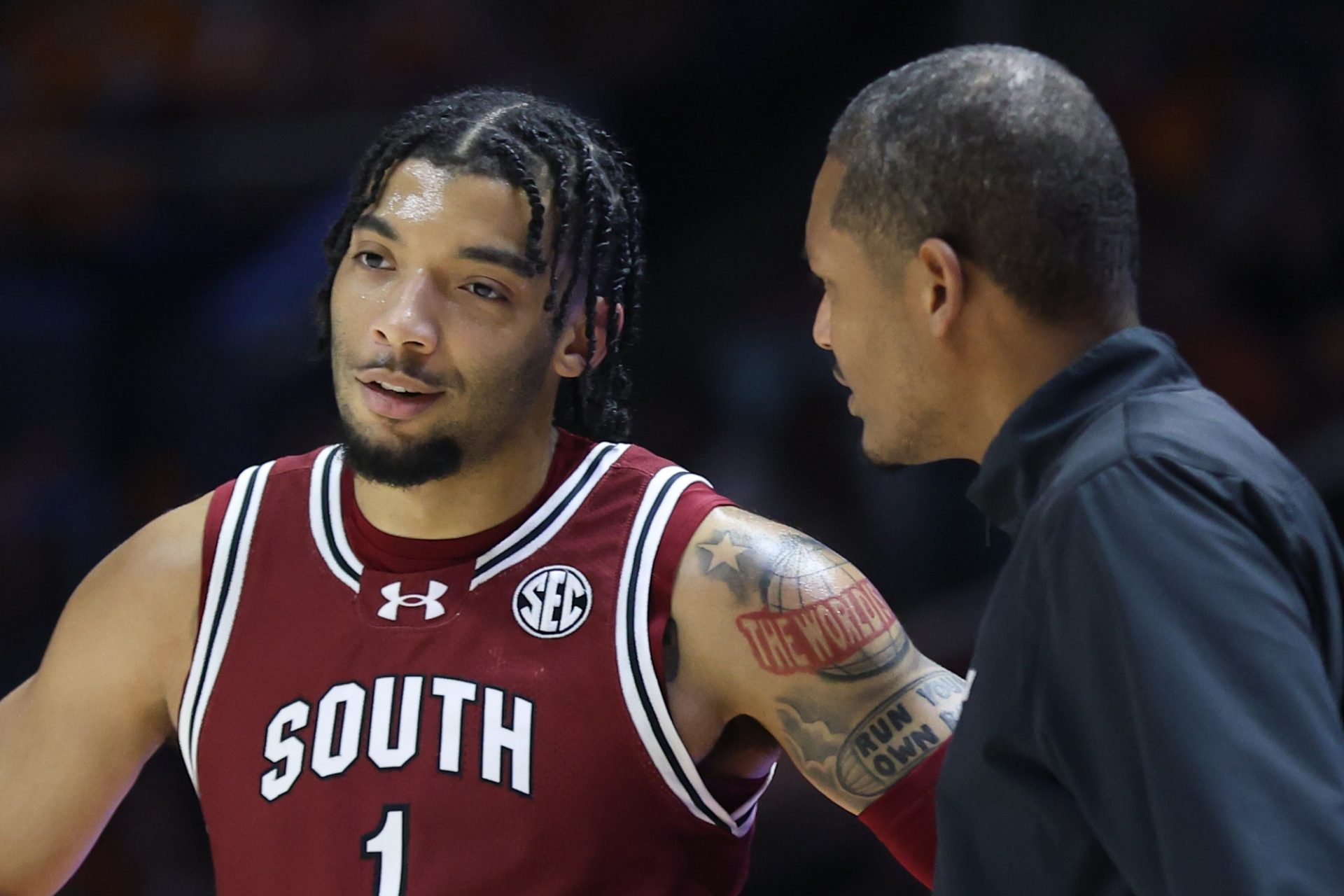 South Carolina Gamecocks guard Jacobi Wright (1) speaks with head coach Lamont Paris during the first half against the Tennessee Volunteers at Thompson-Boling Arena at Food City Center.