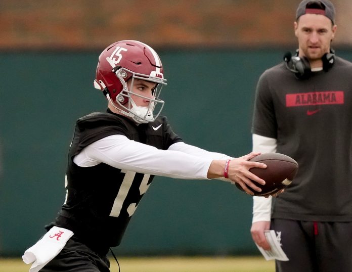 Quarterback Ty Simpson works a drill during Spring Practice for the Crimson Tide.