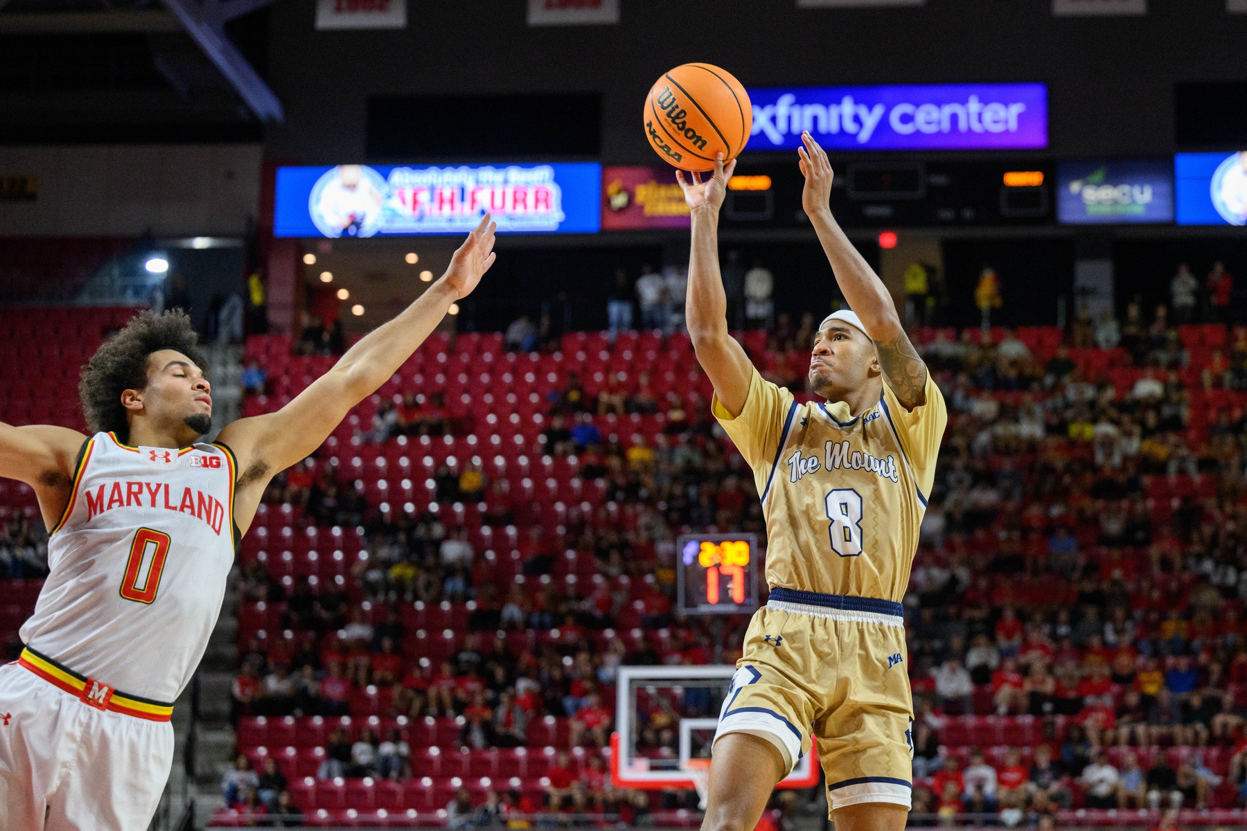 Mount St. Mary's Mountaineers guard Dallas Hobbs (8) shoots over Maryland Terrapins guard Ja'Kobi Gillespie (0) during the first half at Xfinity Center.