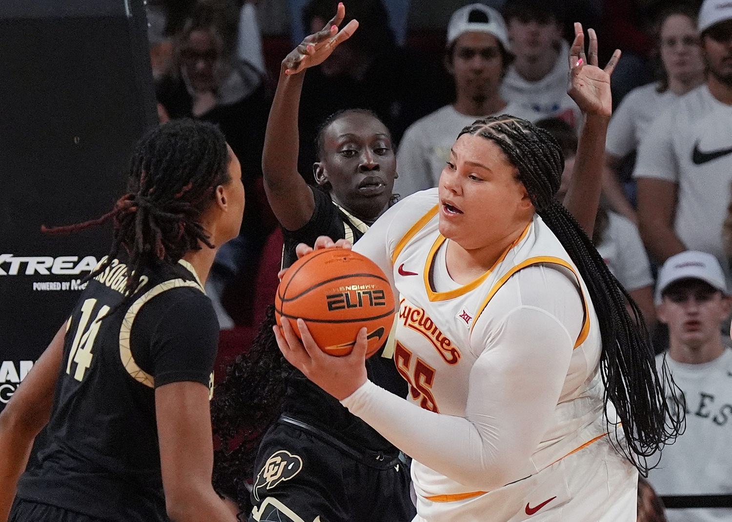 Iowa State center Audi Crooks (55) rebounds the ball around Colorado forward Jade Masogayo (14) and forward Nyamer Diew (11) at Hilton Coliseum