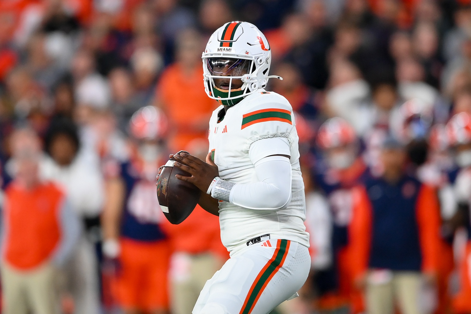 Miami Hurricanes quarterback Cam Ward (1) looks to pass against the Syracuse Orange during the first half at the JMA Wireless Dome.