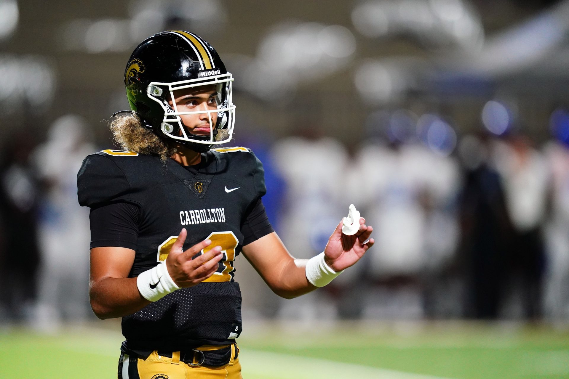 Carrollton Trojans quarterback Julian Lewis (10) reacts to a play against the Westlake Lions during the first half at Grisham Stadium. The 15-year-old Carrollton High student has already committed to playing for the University of Southern California Trojans and has been considered one of the top high school quarterback prospects.