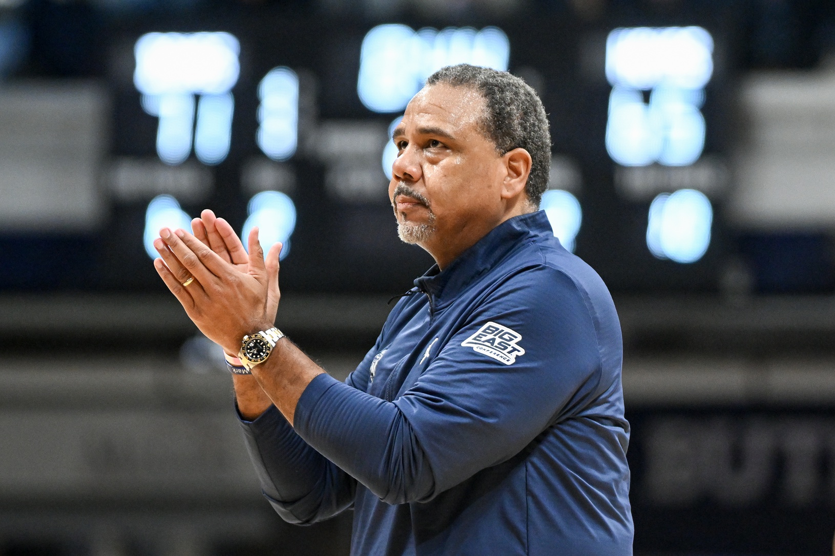 Georgetown Hoyas head coach Ed Cooley claps his hands during a timeout during the second half against the Butler Bulldogs at Hinkle Fieldhouse.