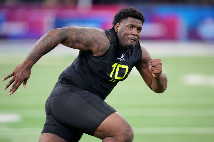 Florida State defensive lineman Joshua Farmer (DL10) participates in drills during the 2025 NFL Combine at Lucas Oil Stadium.