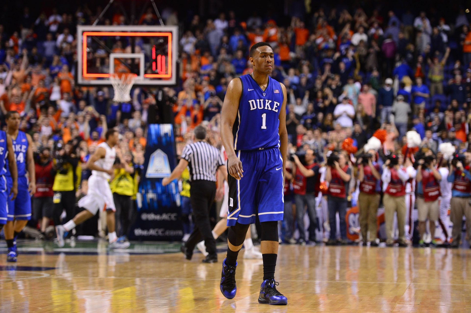 Duke Blue Devils forward Jabari Parker (1) walks off after the game. The Cavilers defeated the Blue Devils 72-63 in the championship game of the ACC college basketball tournament at Greensboro Coliseum.