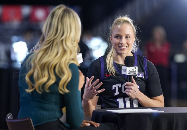 TCU Horned Frogs guard Hailey Van Lith (10) talks with reporter Hannah Wing during the Big 12 Women’s Basketball Media Day at T-Mobile Center.