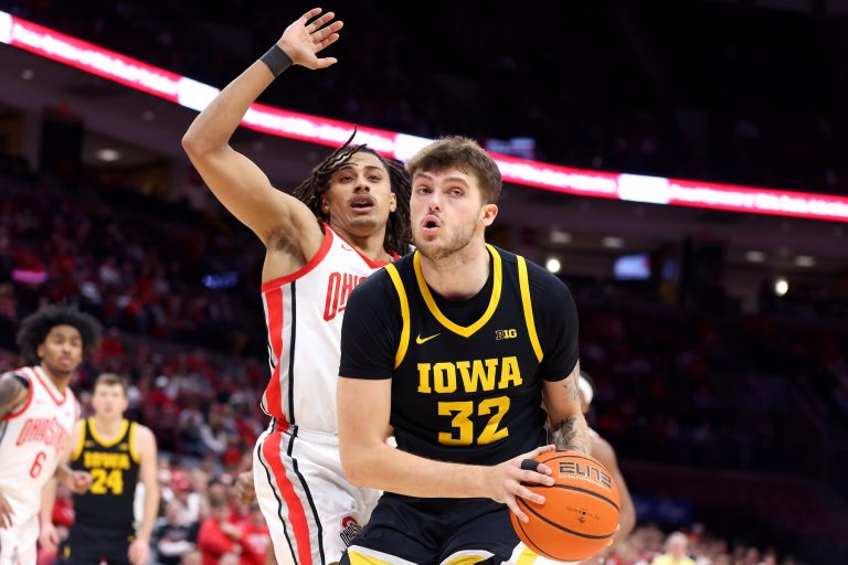 Iowa Hawkeyes forward Owen Freeman (32) controls the ball as Ohio State Buckeyes forward Devin Royal (21) defends during the first half at Value City Arena.