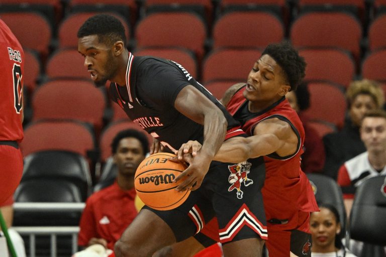 Arkansas State Red Wolves forward Izaiyah Nelson (35) tries to strip the ball from Louisville Cardinals forward Brandon Huntley-Hatfield (5) during the first half at KFC Yum! Center.