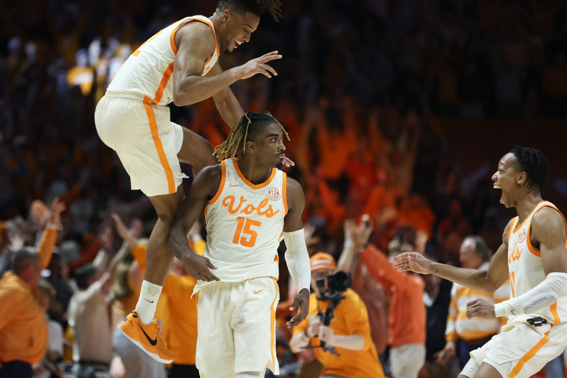 Tennessee Volunteers guard Chaz Lanier (2) and guard Jordan Gainey (11) celebrate with guard Jahmai Mashack (15) Mashack after hitting a game winning three pointer against the Alabama Crimson Tide at Thompson-Boling Arena at Food City Center.