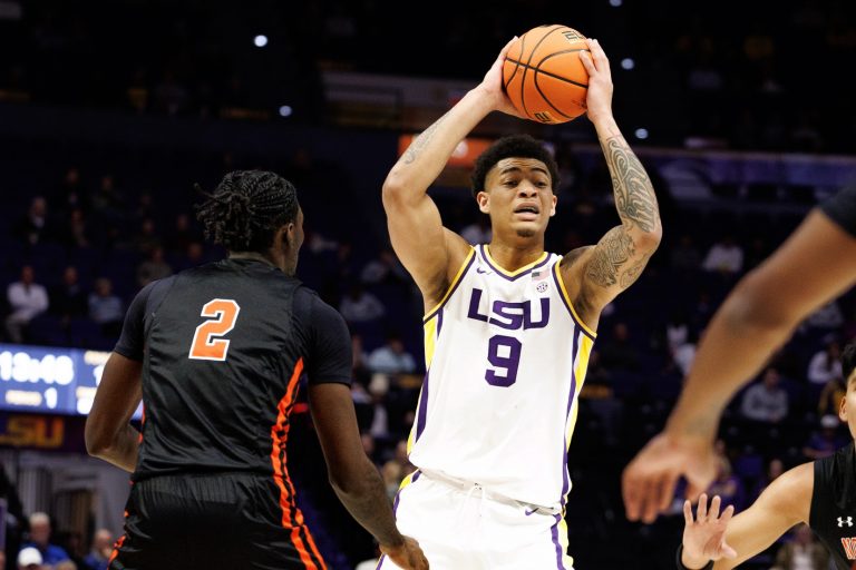 LSU Tigers forward Jalen Reed (9) looks to pass the ball against Northwestern State Demons forward Jerald Colonel (2) during the first half at Pete Maravich Assembly Center.