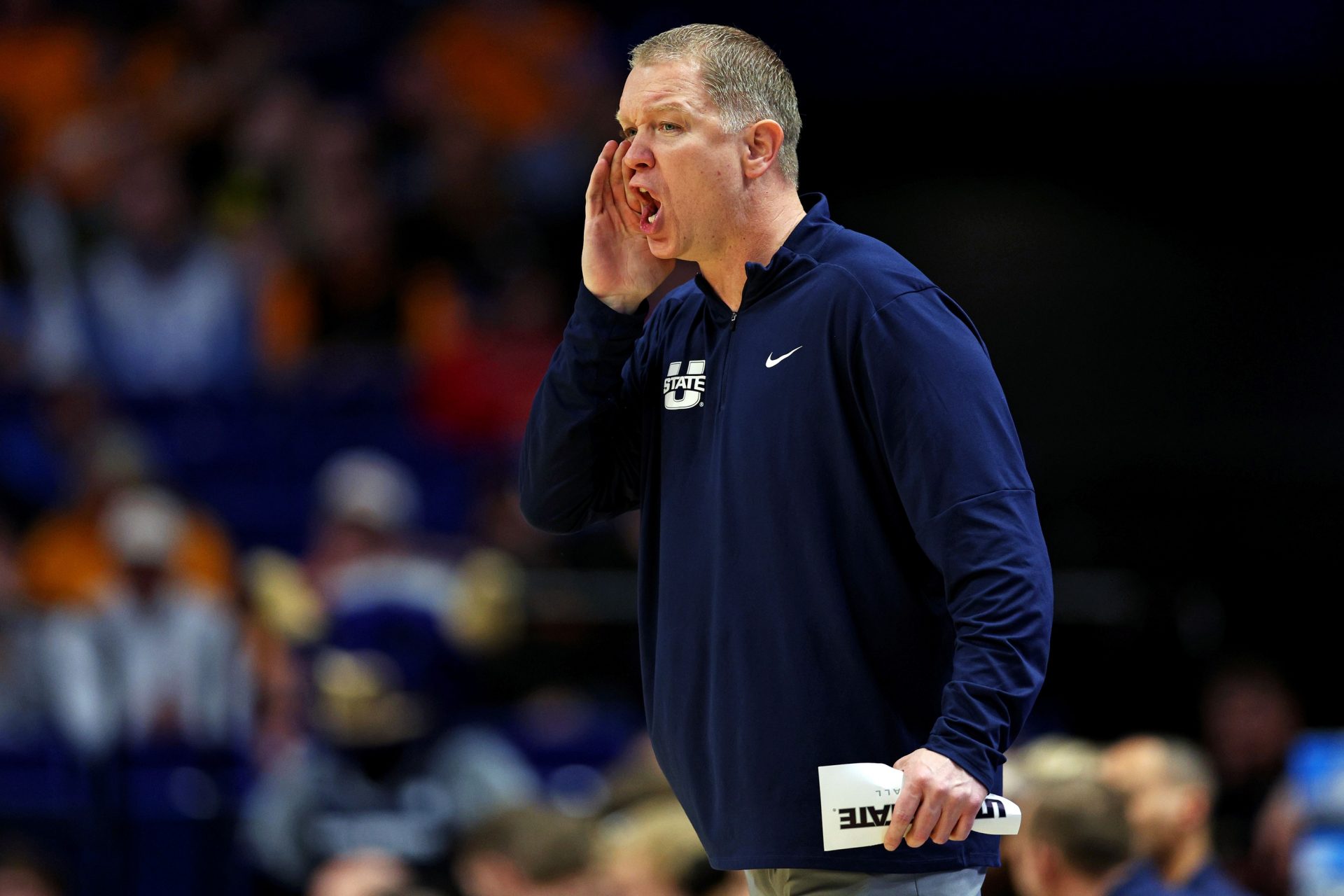 Utah State Aggies head coach Jerrod Calhoun calls to his team during the first half against the UCLA Bruins in the first round of the NCAA Tournament at Rupp Arena.