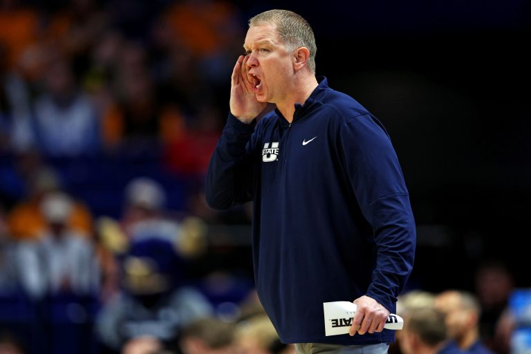 Utah State Aggies head coach Jerrod Calhoun calls to his team during the first half against the UCLA Bruins in the first round of the NCAA Tournament at Rupp Arena.