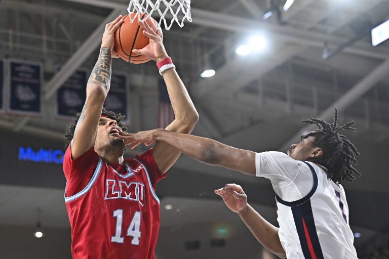 Loyola Marymount Lions forward Jevon Porter (14) rebounds against Gonzaga Bulldogs guard Michael Ajayi (1) in the first half at McCarthey Athletic Center.