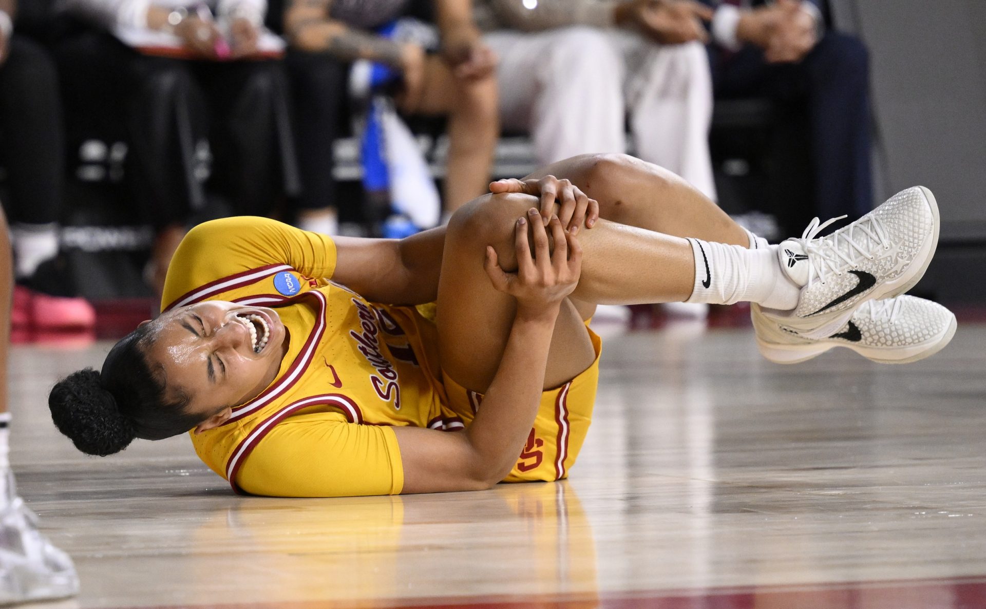 USC Trojans guard JuJu Watkins (12) grabs her knee after falling to the floor during an NCAA Tournament second round game against the Mississippi State Bulldogs at Galen Center.