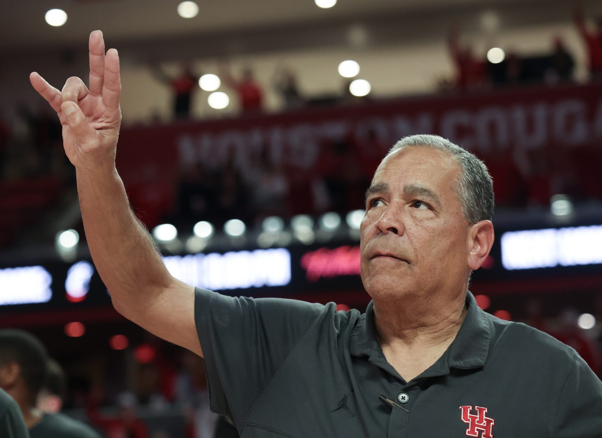 Houston Cougars head coach Kelvin Sampson sings the school song  after defeating the Iowa State Cyclones in the second half at Fertitta Center.
