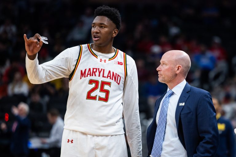 Maryland Terrapins head coach Kevin Willard talks with center Derik Queen (25) in the second half against the Michigan Wolverines at Gainbridge Fieldhouse.