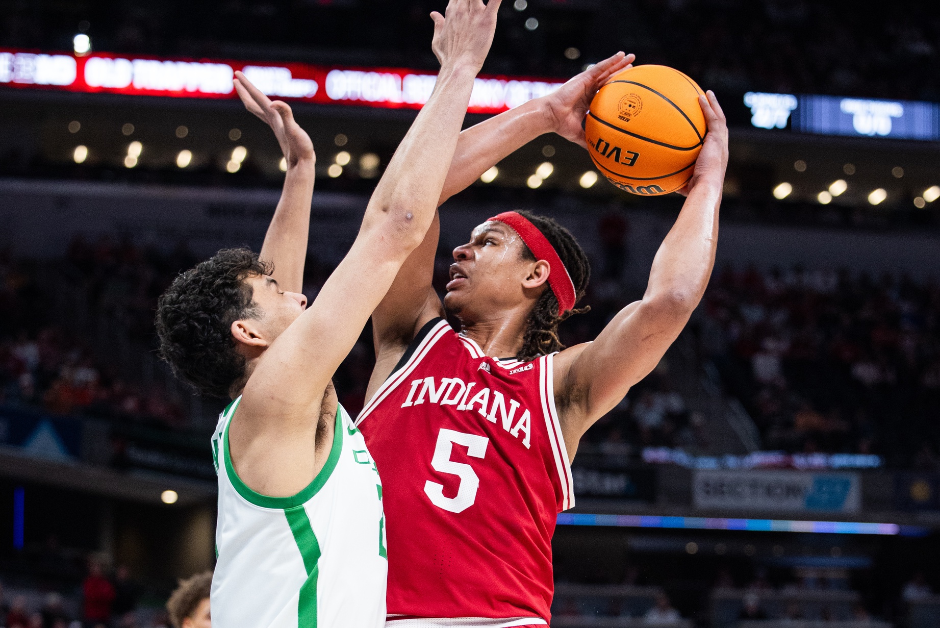 Indiana Hoosiers forward Malik Reneau (5) shoots the ball while Oregon Ducks forward Brandon Angel (21) defends in the first half at Gainbridge Fieldhouse.