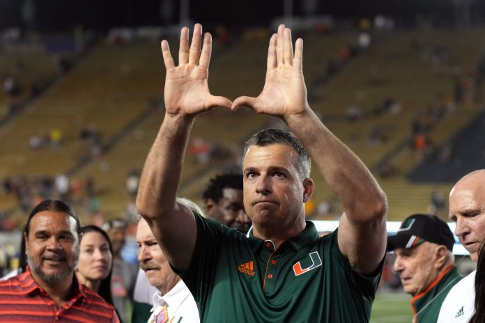 Miami Hurricanes head coach Mario Cristobal gestures after defeating the California Golden Bears at California Memorial Stadium.