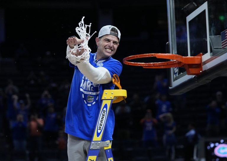 Florida Gators head coach Todd Golden celebrates after cutting the net down following the Florida Gators win over the Texas Tech Red Raiders during the West Regional final of the 2025 NCAA tournament at Chase Center.