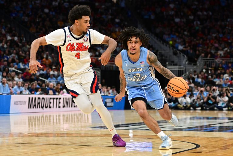 North Carolina Tar Heels guard Elliot Cadeau (3) drives against Mississippi Rebels forward Jaemyn Brakefield (4) during the first half of a first round NCAA men’s tournament game at Fiserv Forum.