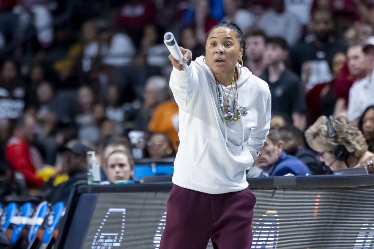 South Carolina Gamecocks head coach Dawn Staley signals to her team during the second half of an Elite 8 NCAA Tournament basketball game against the Duke Blue Devils at Legacy Arena.