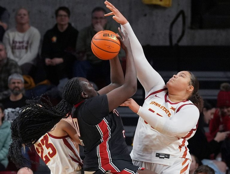Iowa State Cyclones' center Audi Crooks (55) blocks the ball as Texas Tech Lady Raiders center Achol Magot (10) attempts to shoot during the first quarter in the Big-12 women’s basketball showdown at Hilton Coliseum