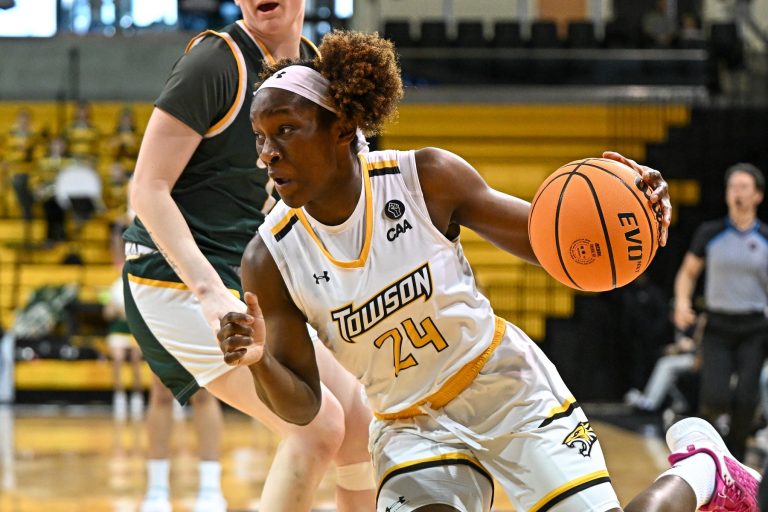 Towson Tigers guard Patricia Anumgba (24) dribbles the ball against the William & Mary Tribe defense during the first half at SECU Arena.