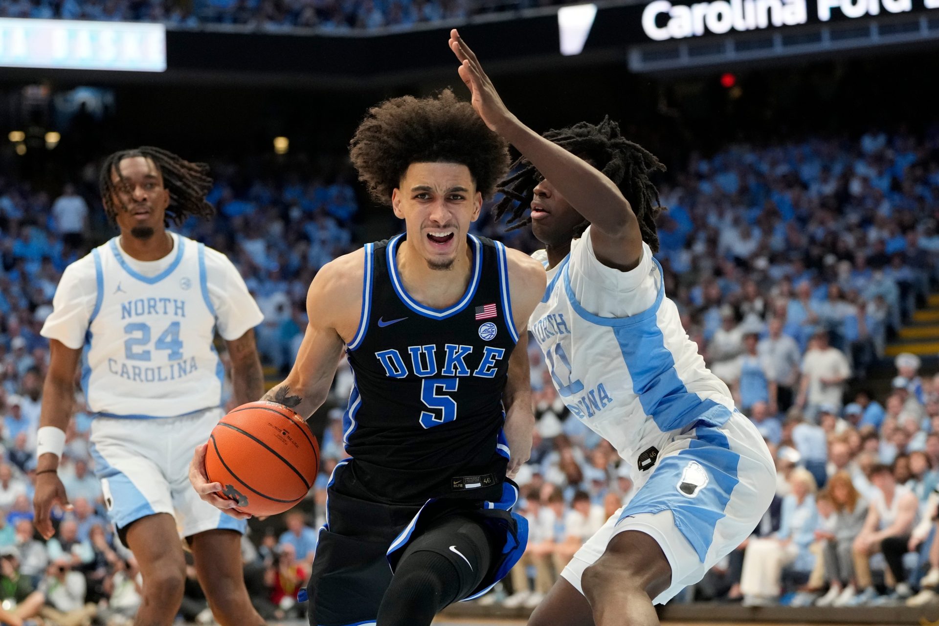 Duke Blue Devils guard Tyrese Proctor (5) with the ball as North Carolina Tar Heels guard Ian Jackson (11) defends in the first half at Dean E. Smith Center.