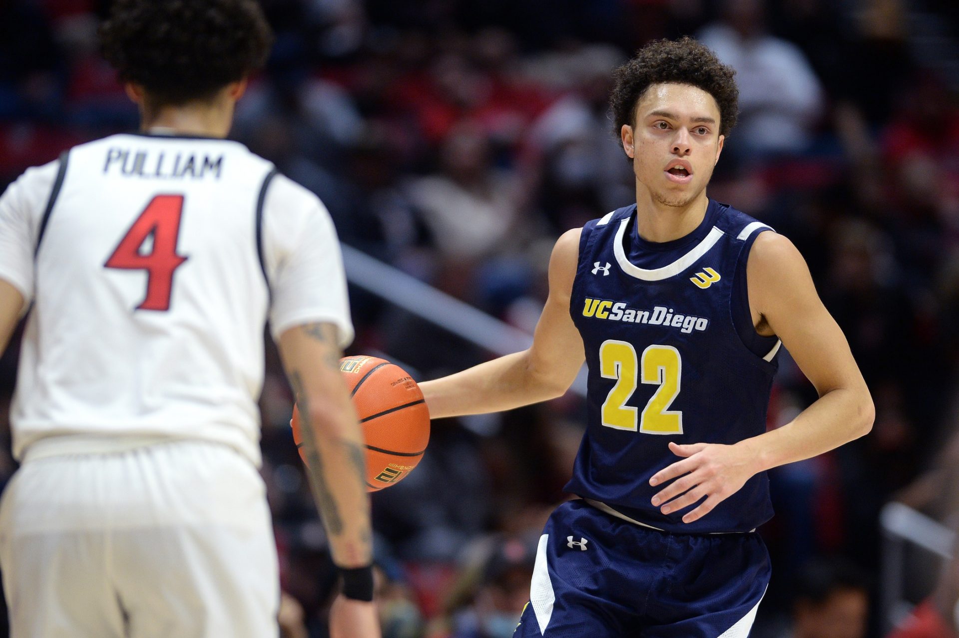 UC San Diego Tritons guard Jace Roquemore (22) dribbles the ball while defended by San Diego State Aztecs guard Trey Pulliam (4) during the second half at Viejas Arena.