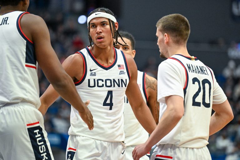 Connecticut Huskies forward Isaiah Abraham (4) celebrates with Connecticut Huskies center Tarris Reed Jr. (5) and Connecticut Huskies guard Aidan Mahaney (20) during the second half against the Maryland Eastern Shore Hawks at XL Center.