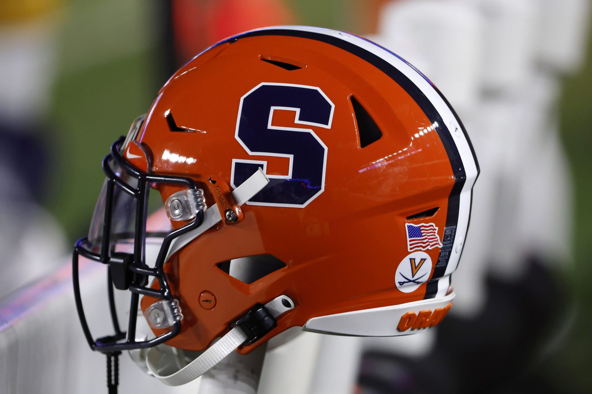 The logo of the Syracuse Orange is seen on a helmet during the second half of their game against the Boston College Eagles at Alumni Stadium.