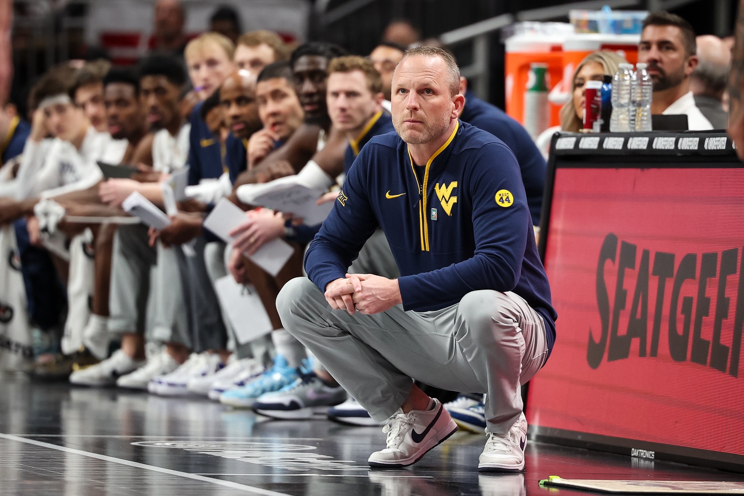 West Virginia Mountaineers coach Darian DeVries watches game play during the first half against the Colorado Buffaloes at T-Mobile Center.