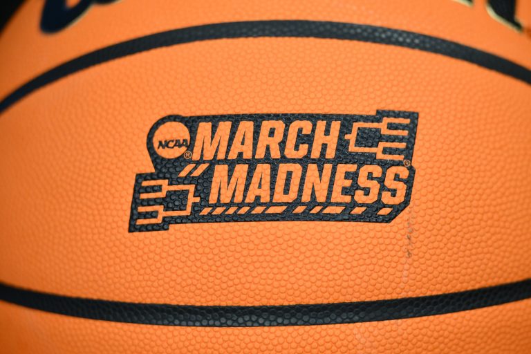 The March Madness logo on a ball during the Memphis Tigers practice at Climate Pledge Arena.
