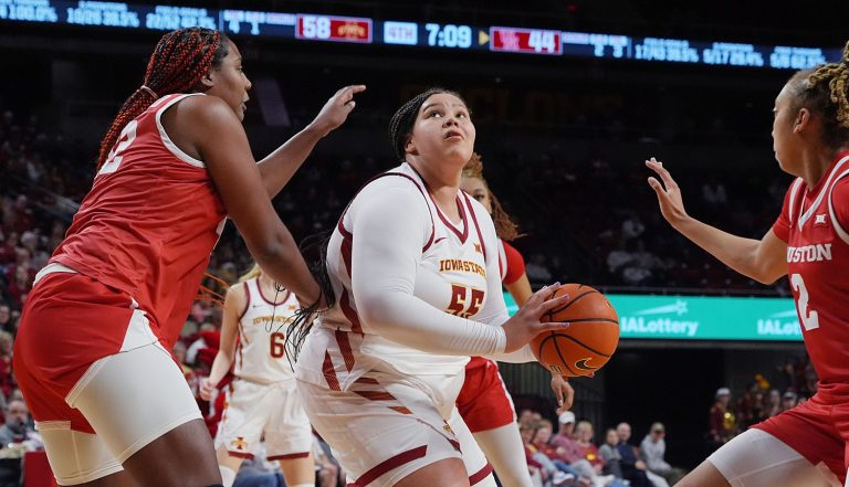 Iowa State Cyclones' center Audi Crooks (55) looks for a shot between Houston Cougars forward Peyton McFarland (42) and guard Kierra Merchant (2) during the fourth quarter in the Big-12 women’s basketball at Hilton Coliseum