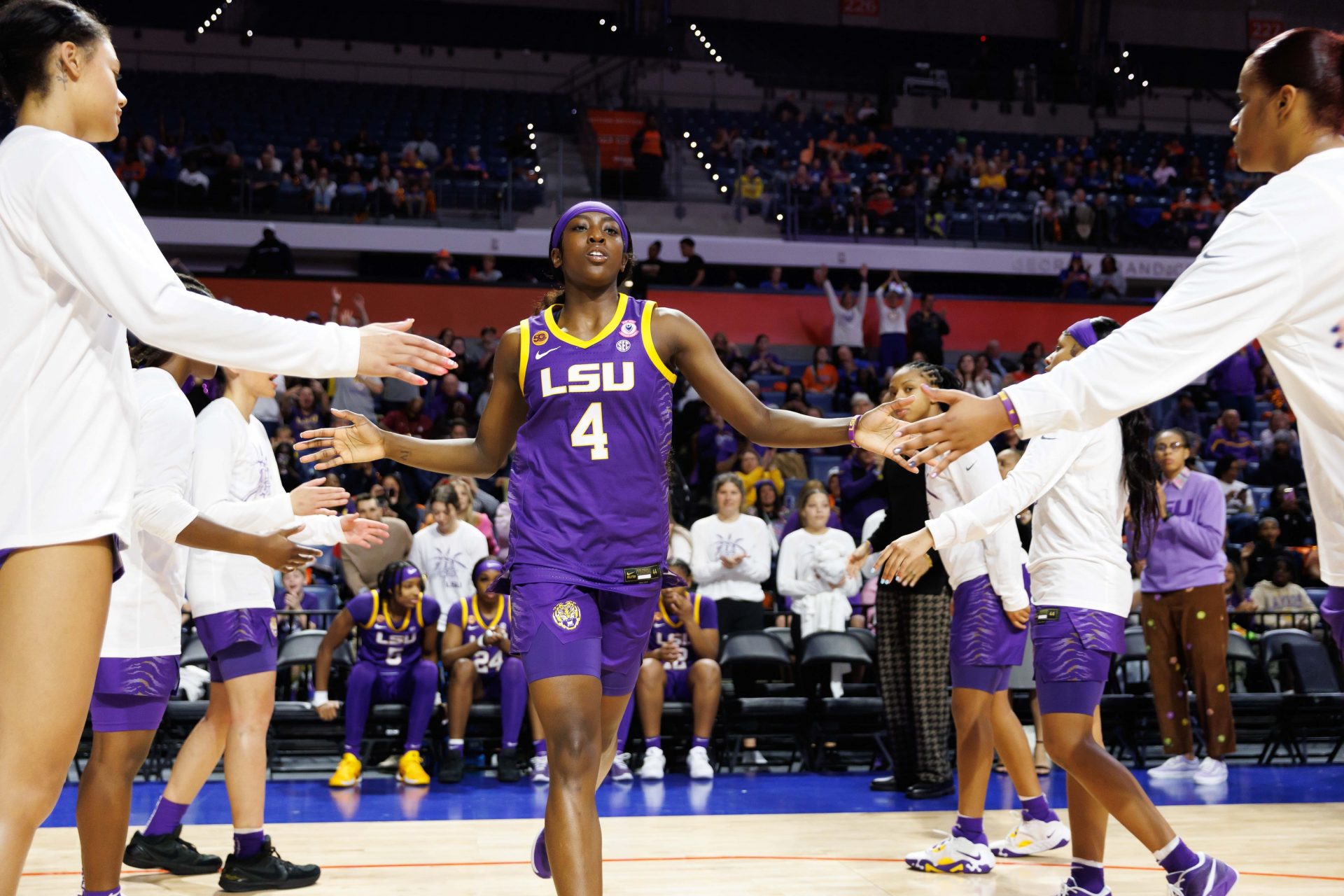 LSU Tigers guard Flau'Jae Johnson (4) shakes hands while being introduced before a game against the Florida Gators at Exactech Arena at the Stephen C. O'Connell Center.