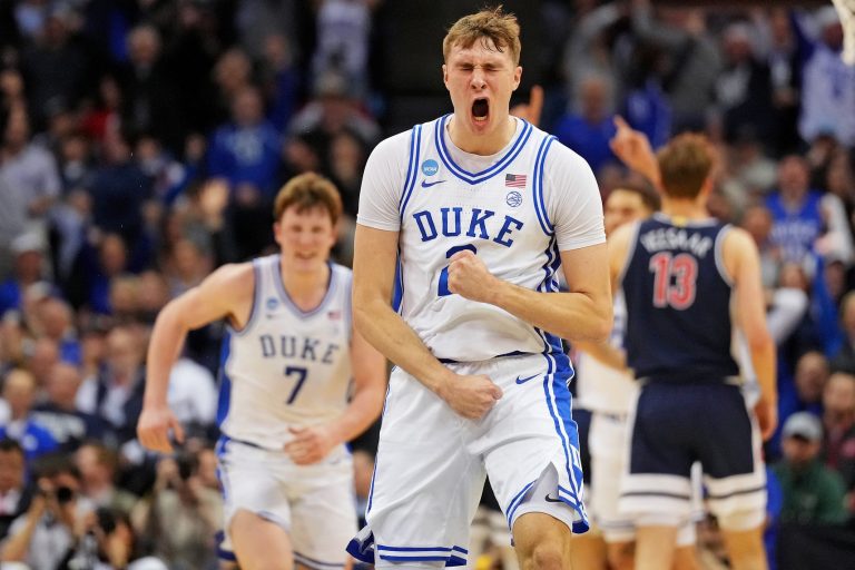 Duke Blue Devils forward Cooper Flagg (2) reacts after making a last second shot to end the first half against the Arizona Wildcats during an East Regional semifinal of the 2025 NCAA tournament at Prudential Center.