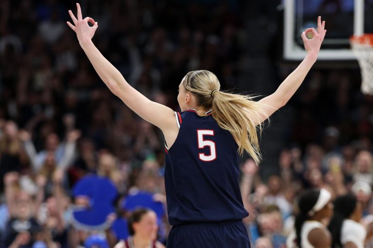 Connecticut Huskies guard Paige Bueckers (5) celebrates a three-point basket against the South Carolina Gamecocks during the second half of the national championship of the women's 2025 NCAA tournament at Amalie Arena.