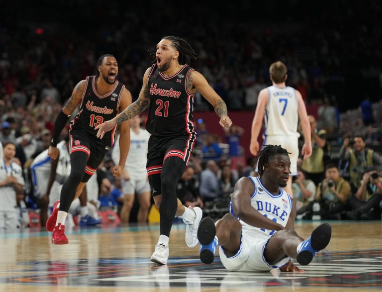 Houston Cougars guard Emanuel Sharp (21) and Houston Cougars forward J'Wan Roberts (13) celebrate defeating the Duke Blue Devils in the semifinals of the men's Final Four of the 2025 NCAA Tournament at the Alamodome.