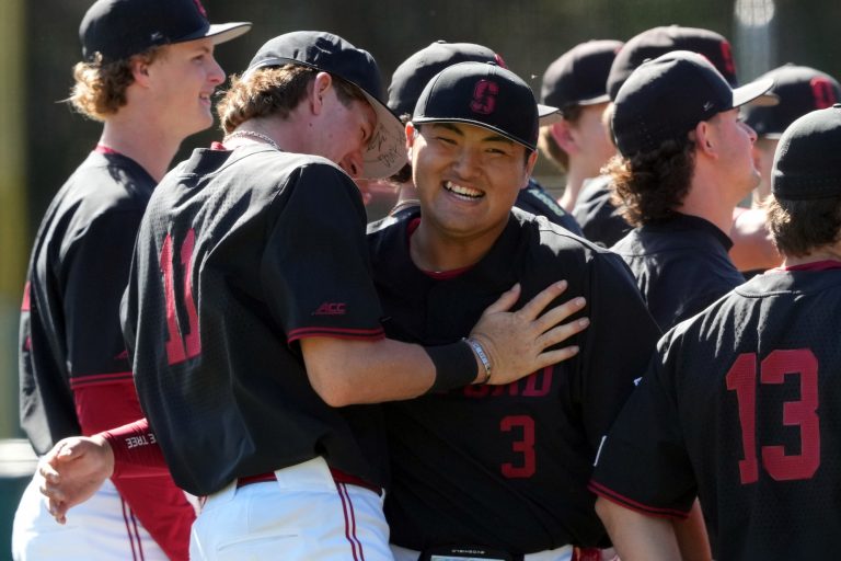 Stanford Cardinal catcher Luke Lavin (11) and first baseman Rintaro Sasaki (3) laugh before the game against the Xavier Musketeers at Sunken Diamond.